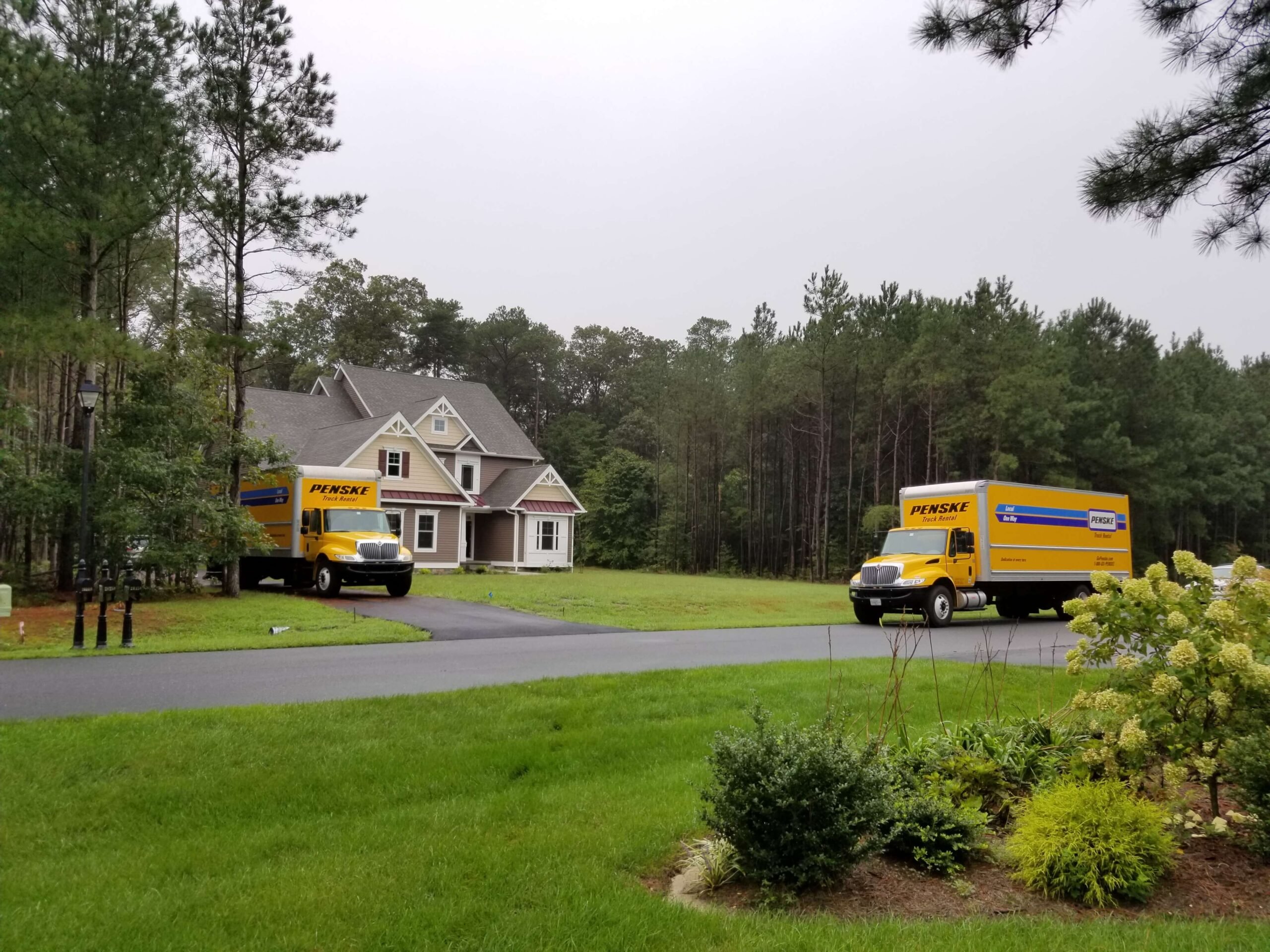 An image of two Skye Moving LLC's residential moving trucks.